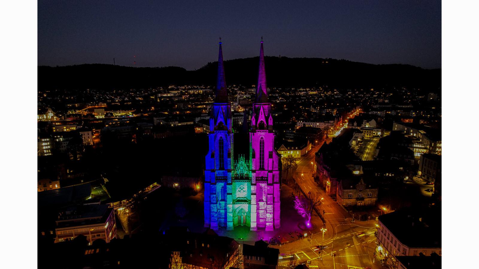 St. Elizabeth Church in Marburg, Germany, lit up for Rare Disease Day on February 28, 2023