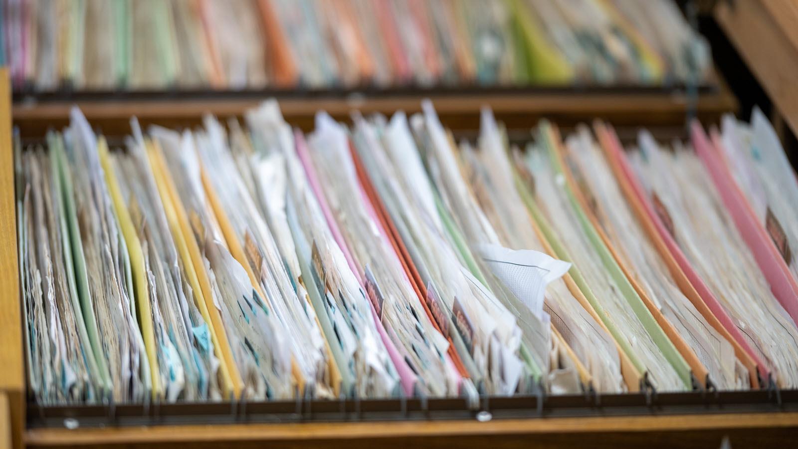 medical records in a packed file drawer