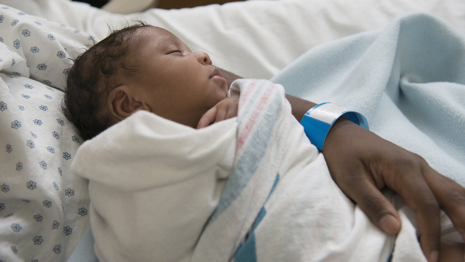 Newborn in mother's arms