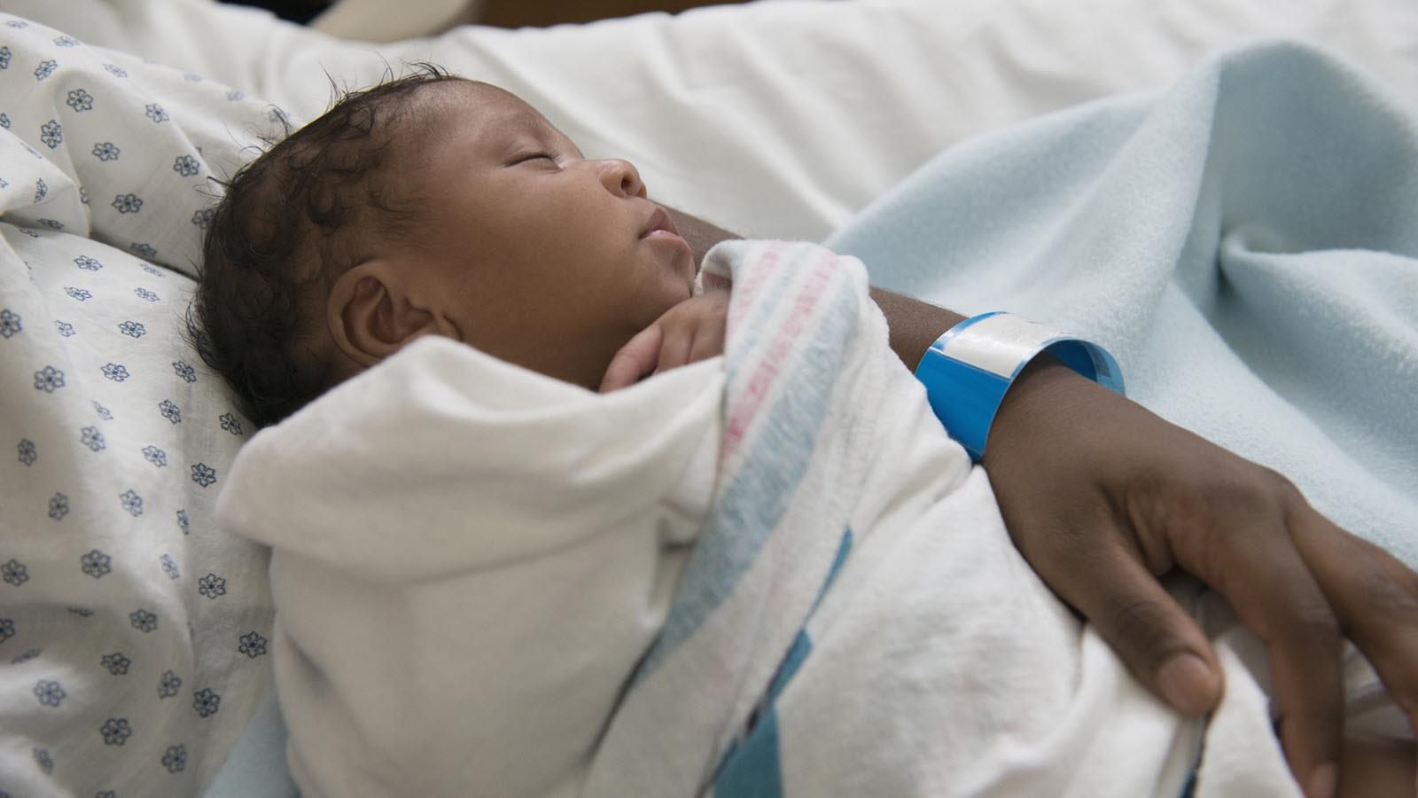 Newborn in mother's arms