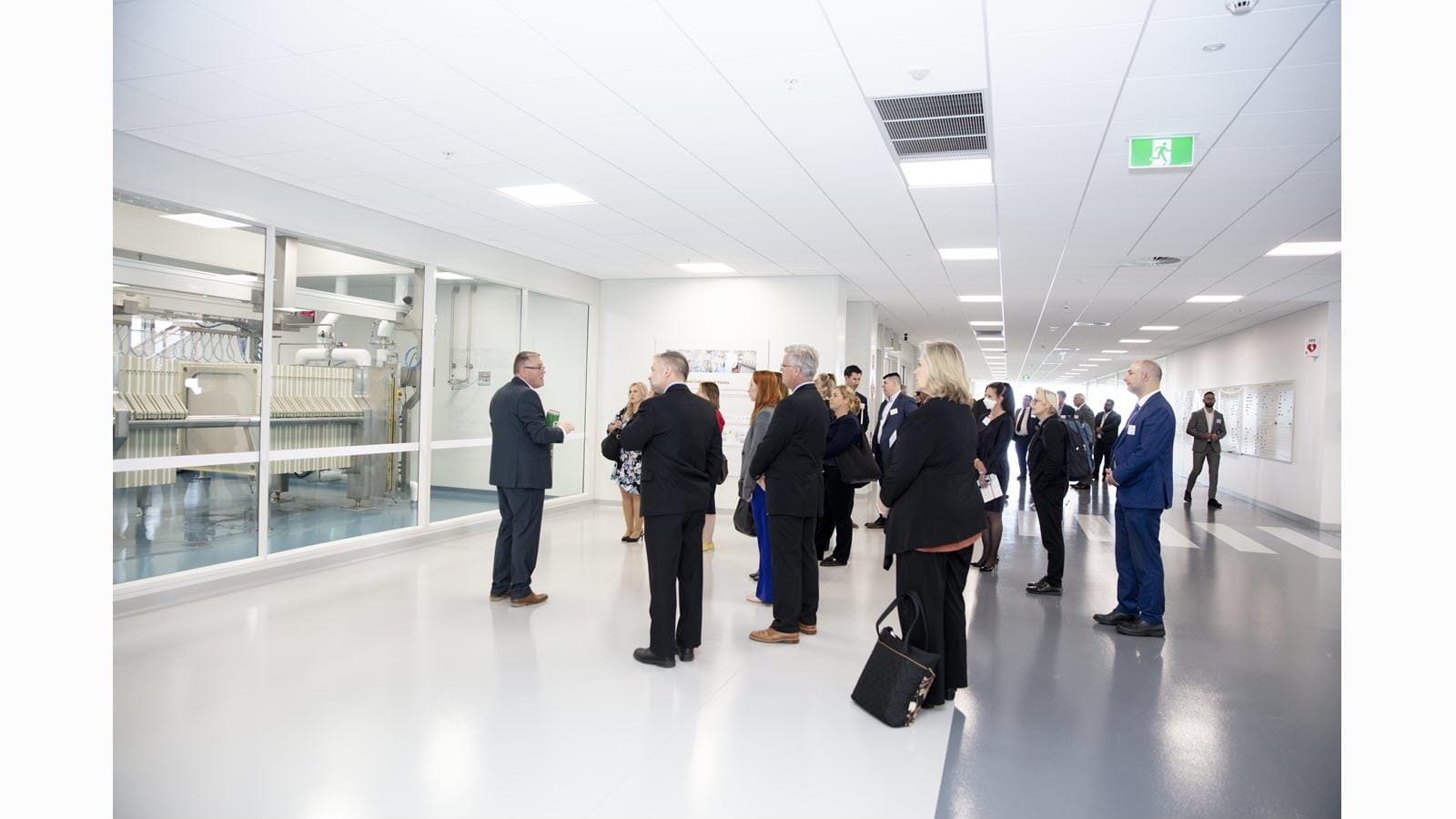 Visitors tour the building and view a filtration step in the process that derives proteins from donated human plasma.