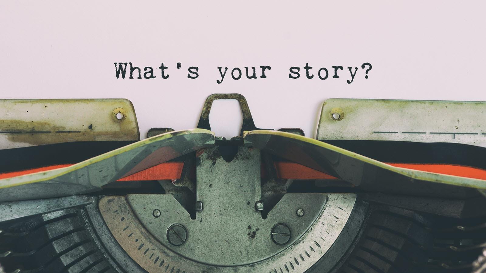 Paper in a typewriter that says "What's your story?"