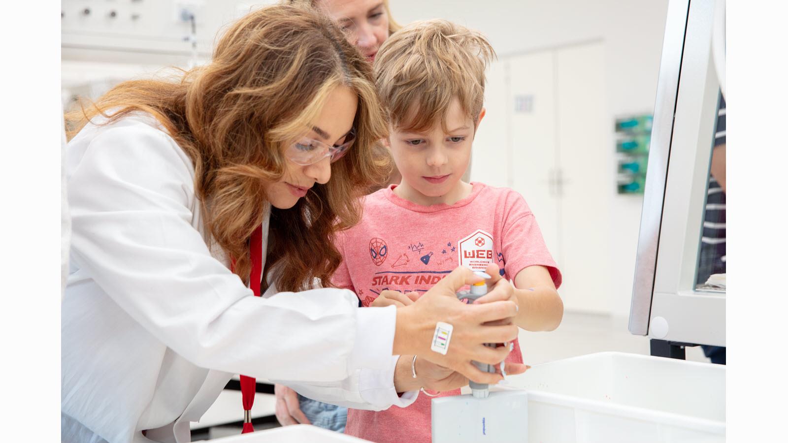 Boy visits a lab during CSL's Friends & Family Day.