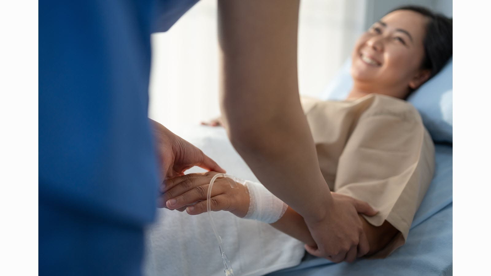 Infusion nurse cares for a patient who has an IV
