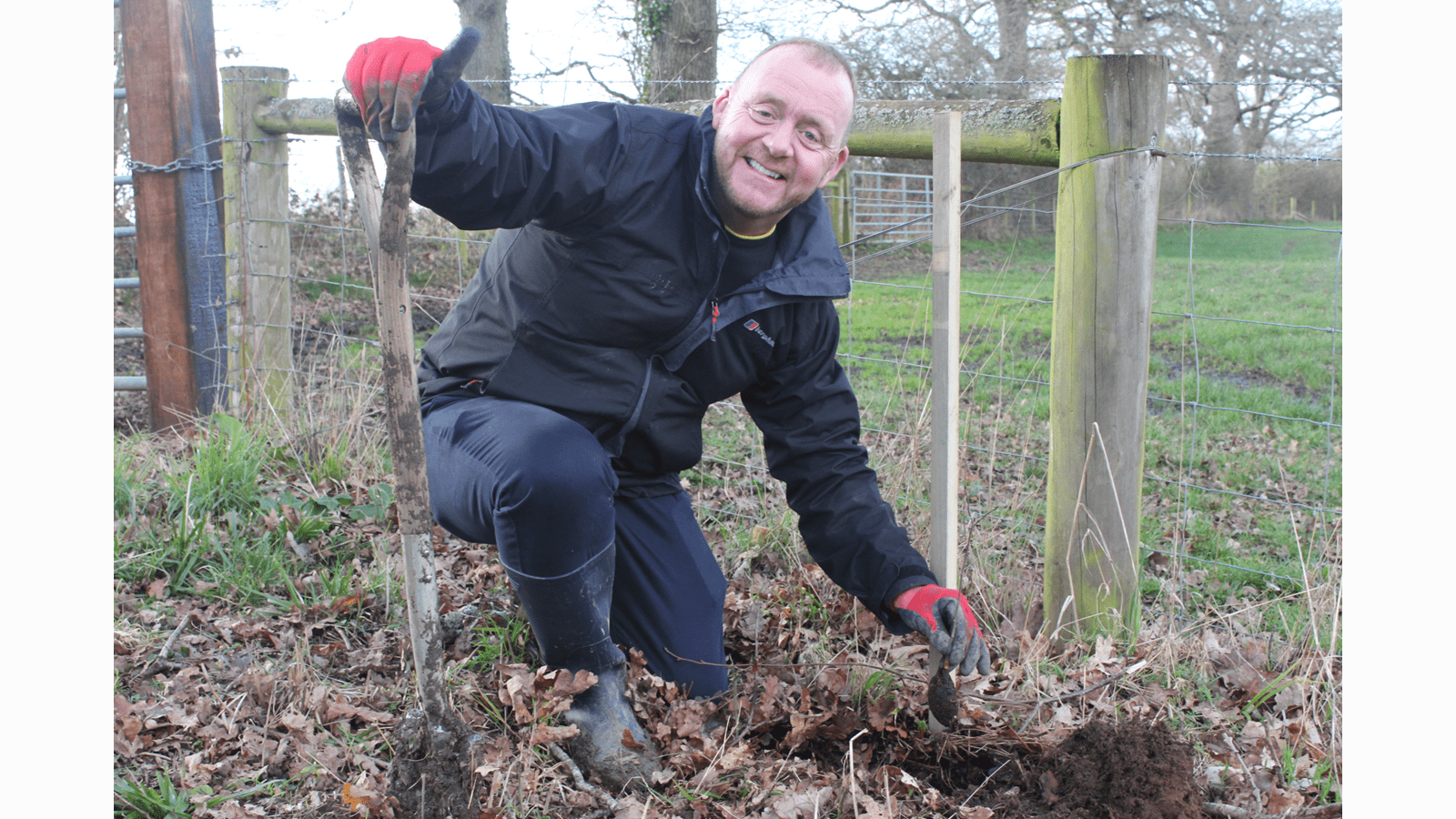 Kieran Dowling plants a tree as part of a reforestation project supported by CSL Seqirus