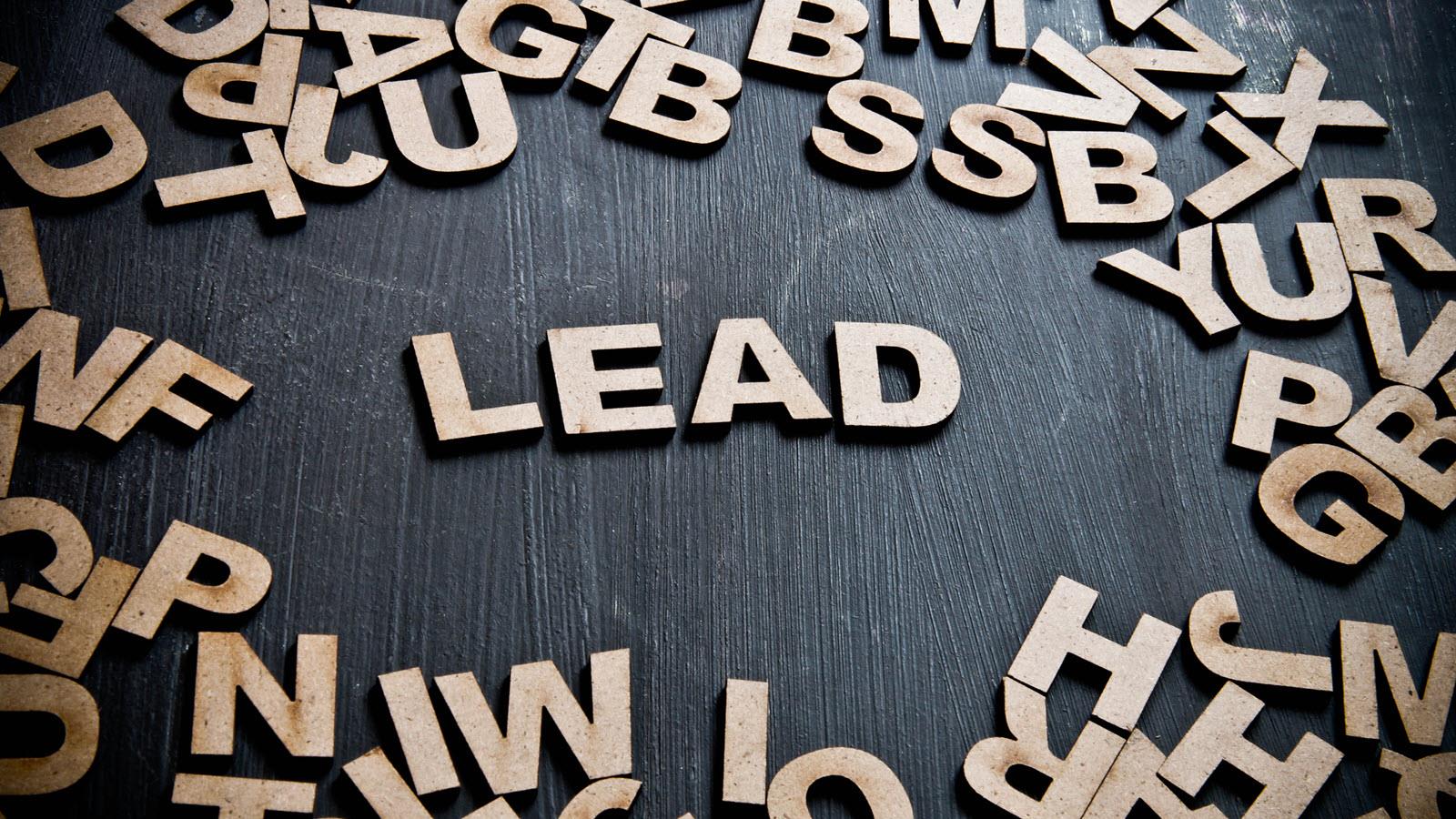 Scattering of letters with the word LEAD in the center