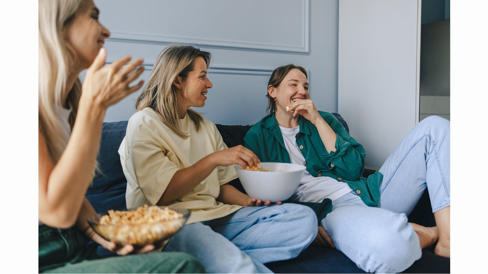 Friends eating popcorn