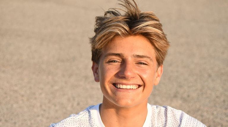 Headshot of Arran Strong on the beach