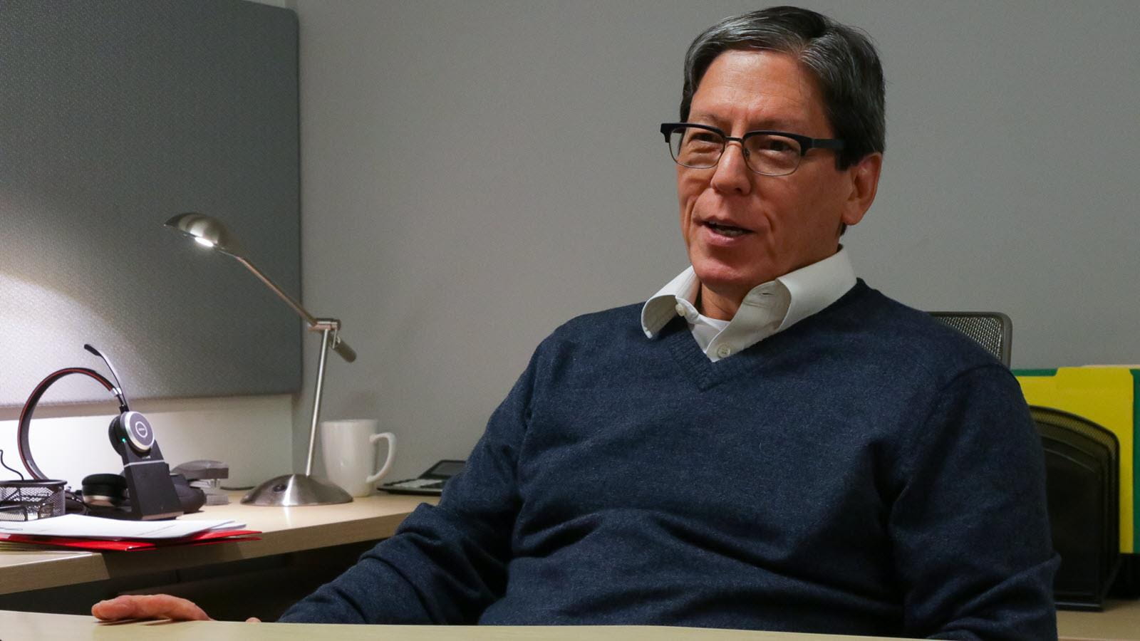 Sickle cell expert Dr. Greg Kato at his desk