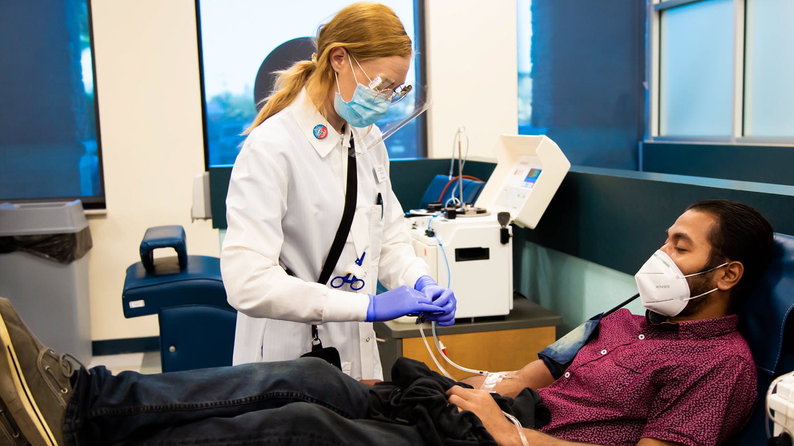 Man wears mask while donating plasma during the pandemic