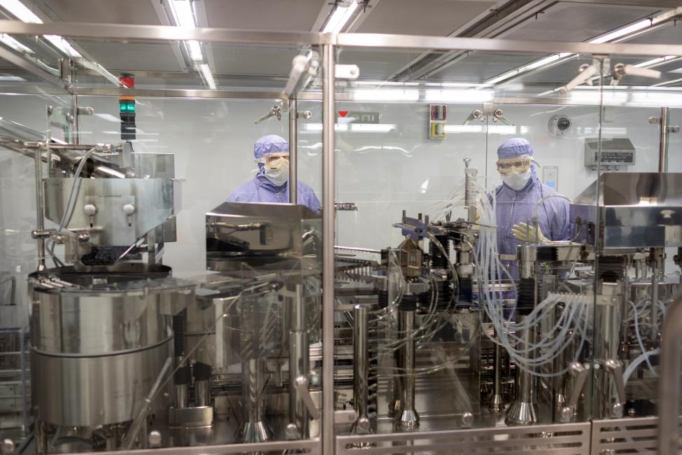 Workers fill vials at CSL Behring Kankakee, Illinois, manufacturing site